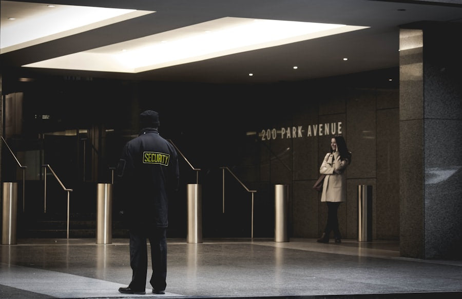 Uniformed security officer posted at a commercial building lobby